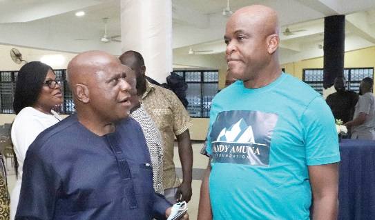 Justice Sulemana Gbadegbe (left), former Justice of the Supreme Court, explaining a point to William Amuna (right), former Chief Executive of GRIDCO, after the launch. Picture: EDNA SALVO-KOTEY